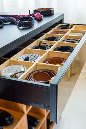 man belts in the wardrobeの写真素材