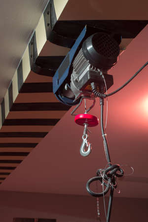 small winch motor attached to a beamの写真素材