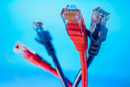 Ethernet connector for internet information networks closeup shot on blue background