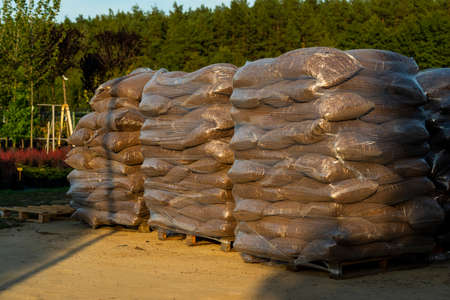 landscaped oak bark in bags for sale outdoorsの写真素材