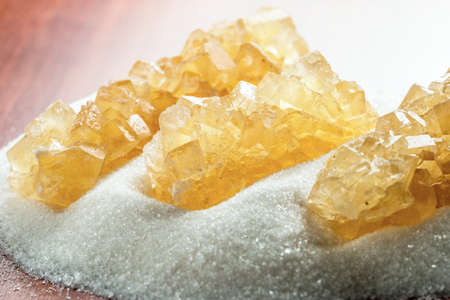 crystal sugar on a background of granulated sugar on the table