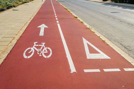 road marking for the movement of bicycles on the sidewalk along the road