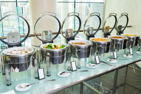 Heated dishes on the banquet tableの写真素材