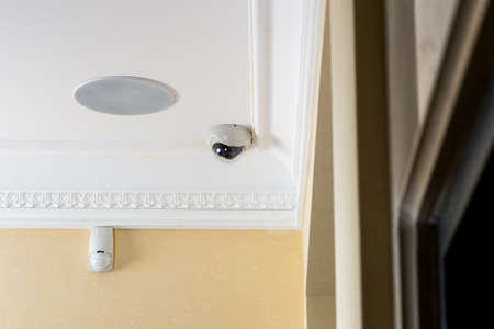 Surveillance camera in the interior on the ceilingの写真素材