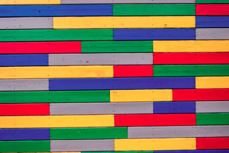 wooden wall painted with different colored inks supply as a separate plateの写真素材