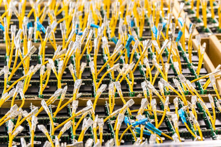chips and cards stacked in a box with protruding wires