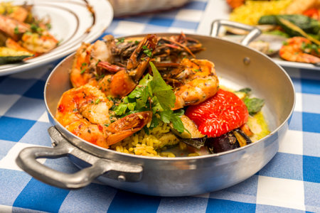 shrimp in a pan with rice and vegetablesの写真素材