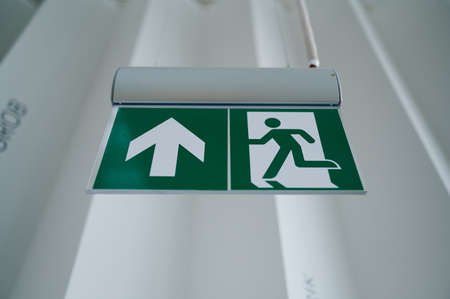 ceiling sign exit entrance , graphic symbol, movement indicator in the interiorの写真素材