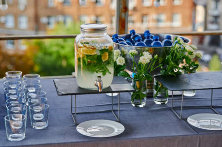 event with catering, lemonade in a glass jar at the reception, treats for guests of the holiday from cold drinksの写真素材