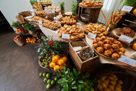 Showcase of sliced bread in the store close-up shot, freshly baked breadの写真素材