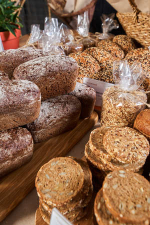 Showcase of sliced bread in the store close-up shot, freshly baked breadの写真素材