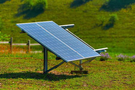 outdoor solar panel installed on legs in nature, green alternative energy