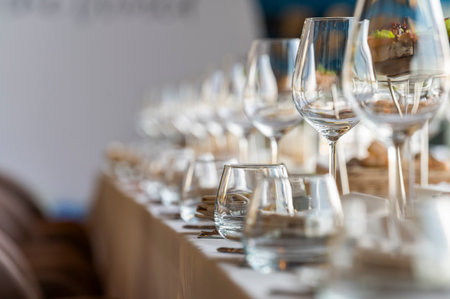 crystal glasses on a served table in a restaurant, glassware for dinner