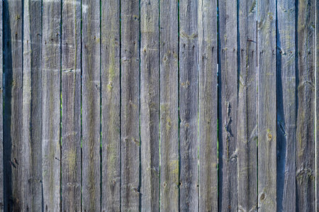 wooden fence made of unpainted boards, old territory fencing, close-upの写真素材
