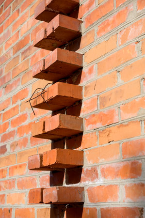 brick stone wall of the house, territory fencing, shot close-upの写真素材