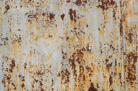 cracked paint on a metal coating, metal with rust, close-up shot