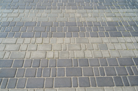 colored stone pavers, street tiles with patterns and ornaments, pedestrian pathの写真素材
