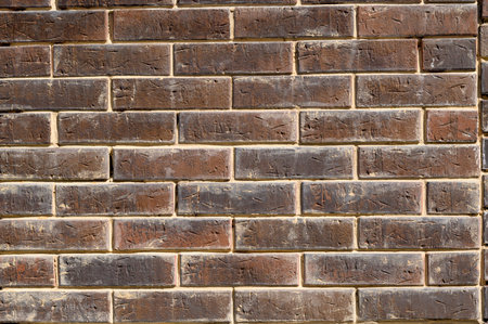 brick stone wall of the house, territory fencing, shot close-upの写真素材