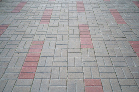 colored stone pavers, street tiles with patterns and ornaments, pedestrian pathの写真素材