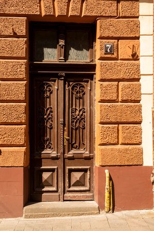 wooden doors with metal inserts and hinges, large part of the building as an element of architecture largeの写真素材