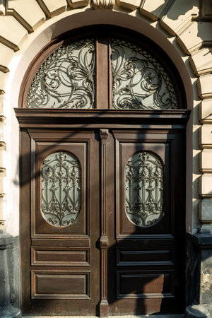 Entrance street carved wooden doors with metal inserts and hinges, large part of the building as an element of architecture largeの写真素材