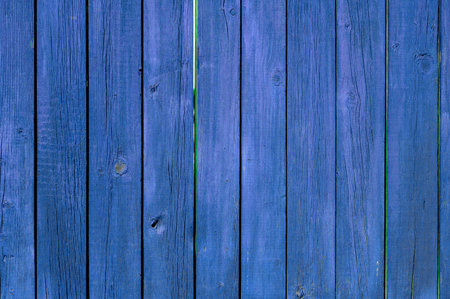 wooden purple boards for the fence, painted with colored paint, shot close-upの写真素材