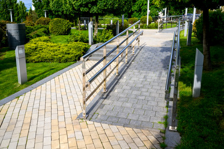 footpaths with steps made of colored stone tiles in landscape design, street tiles with patterns and ornamentsの写真素材