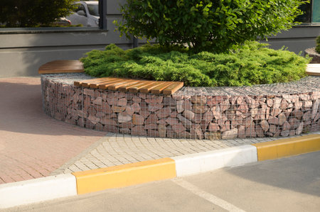 footpaths with steps made of colored stone tiles in landscape design, street tiles with patterns and ornamentsの写真素材