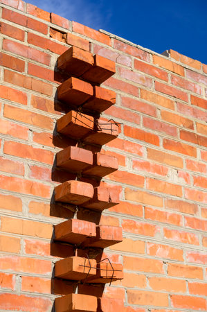 brick stone wall of the house, territory fencing, shot close-upの写真素材