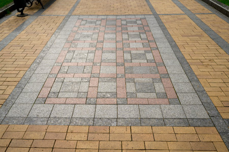colored stone pavers, street tiles with patterns and ornaments, pedestrian pathの写真素材