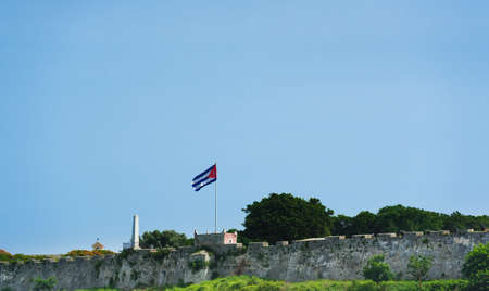 Fortress El Morro in Havana Cuba with national flagの写真素材