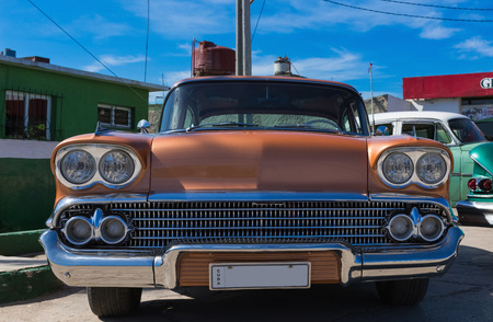 Brown golden american classic car in the front view in Varadero Cubaのeditorial素材