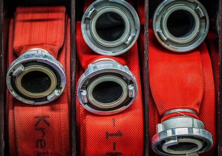HDR - Fire brigade water hose rolled up equipmentの写真素材