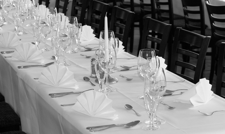 Festive table arrangement with glasses and served and cutleryの写真素材