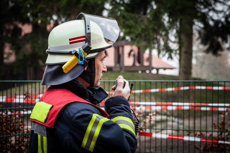HDR - Firefighter operate with a walkie talkie in action - series Firefighterのeditorial素材