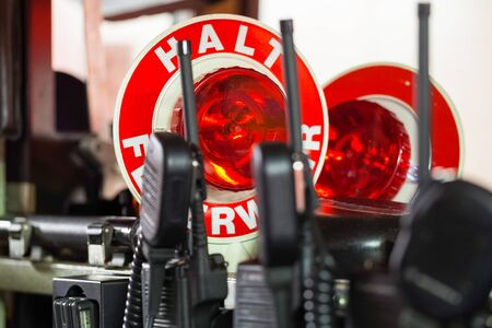 Firefighter equipment in a fire truck with walkie talkie and halt stop trowelの写真素材