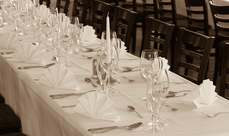 SEPIA - Festive table arrangement with glasses and served and cutleryの写真素材