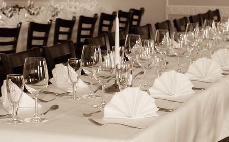 SEPIA - Festive table arrangement with glasses and served and cutleryの写真素材