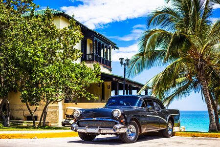 HDR - American black vintage parked car at beach in Varadero Cuba - Serie Cuba Reportageのeditorial素材