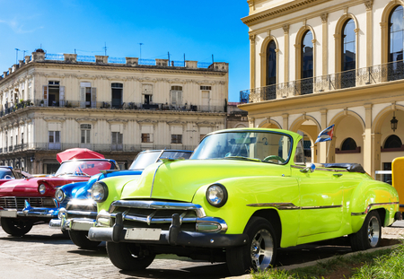 American yellow 1951 and a red 1957 convertible vintage car parked in the historical center from Havana City Cuba - Series Cuba Reportageのeditorial素材