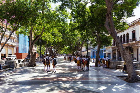 Pedestrian zone on the main street Paseo de Marti with school children on the way to school in Havana Cuba - Serie Cuba Reportageのeditorial素材