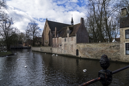 Canal in Bruges, a popular tourist destination in Belgium の写真素材