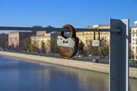Two love padlocks fixed on a bridge across the Moscow River, Russia の写真素材