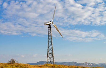 Mast with wind power generator on the background of sky. Wind power farm, Cape Meganom, Crimea.のeditorial素材