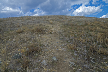 The trail comes to the top of the mountain.