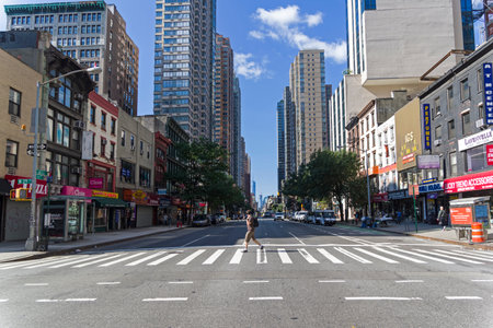 NEW YORK CITY - AUGUST 20, 2017: New York, Manhattan, the intersection of 29th West Street and 6th Avenue. Sunny summer day.のeditorial素材