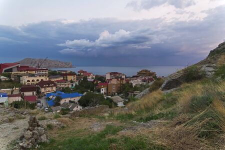 The top view of the resort town of Sudak on a cloudy evening. Crimea, the beginning of September.の写真素材