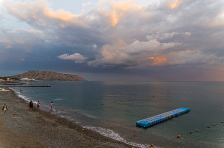 SUDAK, CRIMEA - September 6, 2017: The bay of the resort town of Sudak on a cloudy evening. Crimea.のeditorial素材