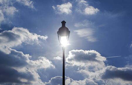 Lantern against the blue sky. The sun shines through the lantern.The sun shines through the lantern.の写真素材