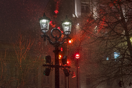 Lantern in the blizzard. Festive multi-colored lighting in the New Year holidays.の写真素材